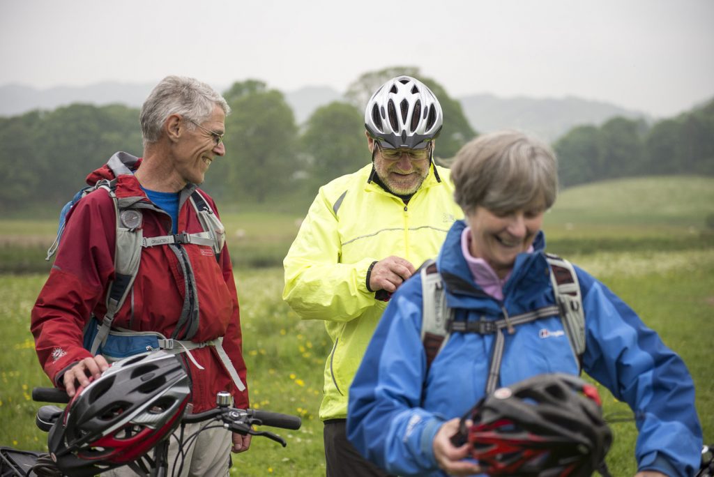 Three cyclists stop to chat on the C2C cycling route in England