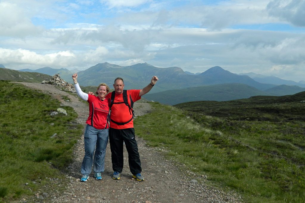 Two people celebrate walking on the West Highland Way