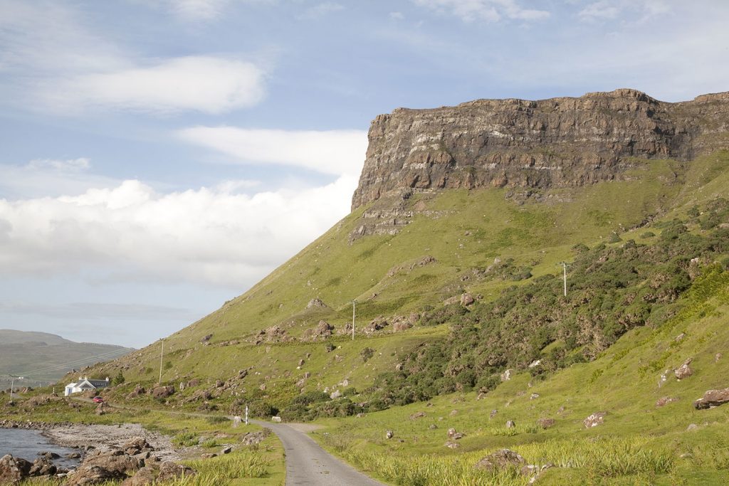 huge headland juts over road on Mull Scotland