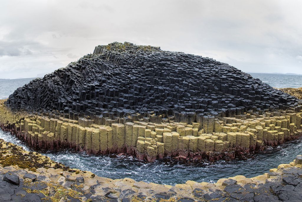 Columnar Basalt columns form an island in Staffa Scotland