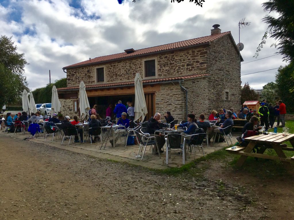 Pilgrims enjoying lunch along the Camino Frances.