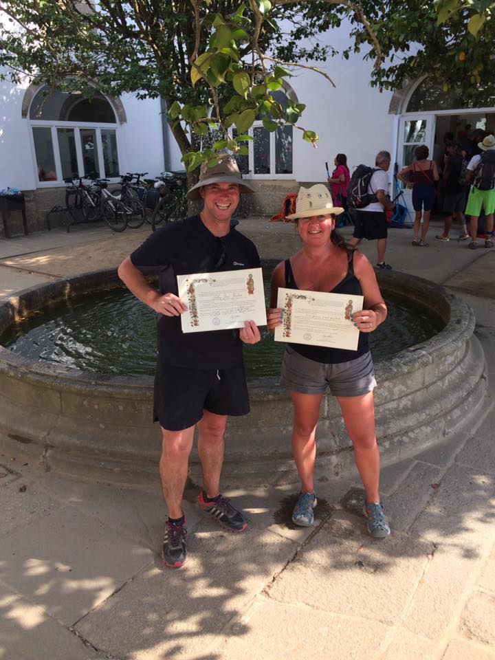 Pilgrims celebrate receiving their Compostela in Santiago