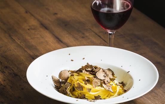 Handmade pasta with a glass of Sagrantino wine