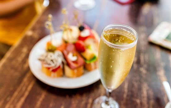 Enjoy a refreshing drink with tapas