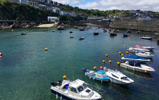 Boats bobbing in pretty English harbour towns