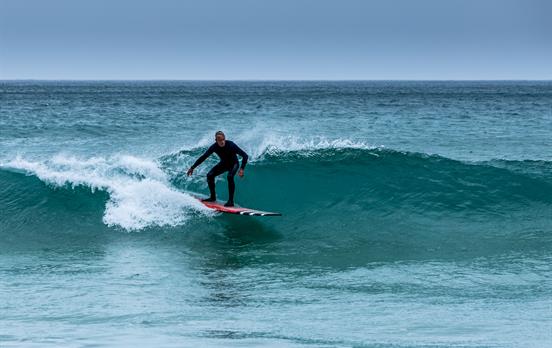 Surfer riding the waves