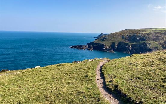 Trail path winding around the coast