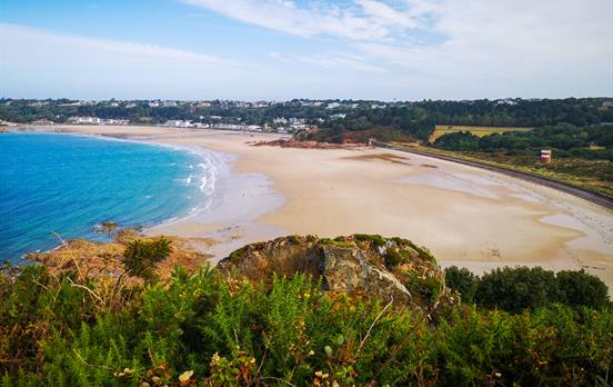 Coastal cliff walking with azure blue waters