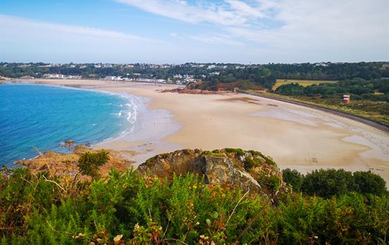 Coastal cliff walking with azure blue waters