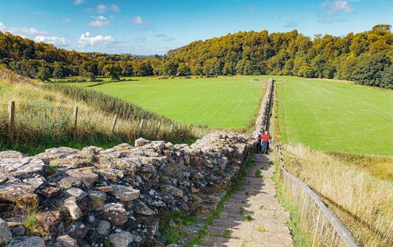 Walk along side large sections of the wall