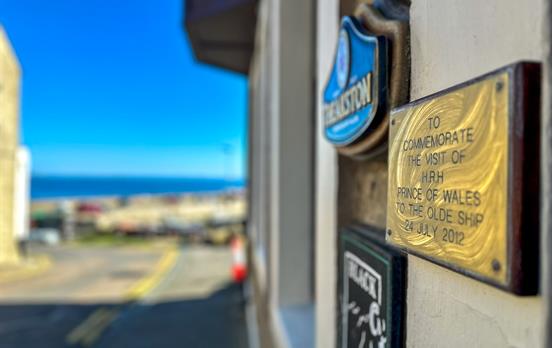 Plaque commerating royalty visting Seahouses