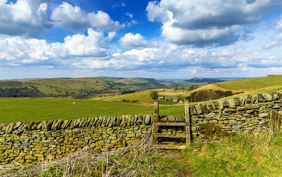 Traditional stone wall and stile on trail