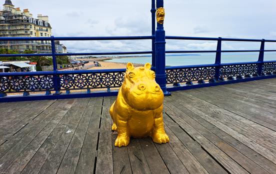 Gold Hippo statue on Eastbourne Pier