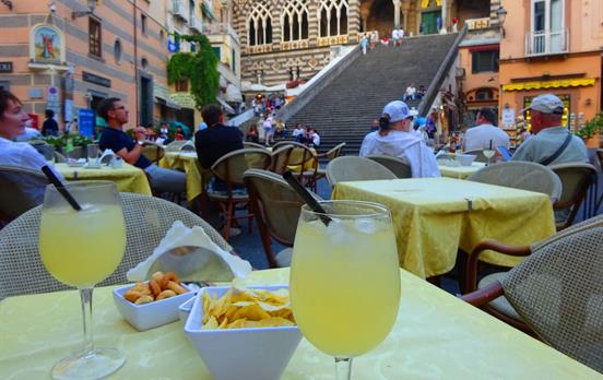 Sampling a limoncello in the piazza of Amalfi