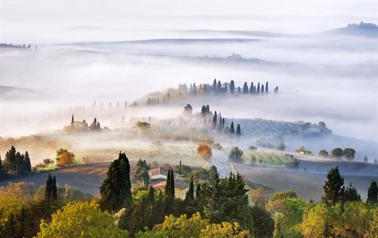 Early morning mist surrounding Pienza