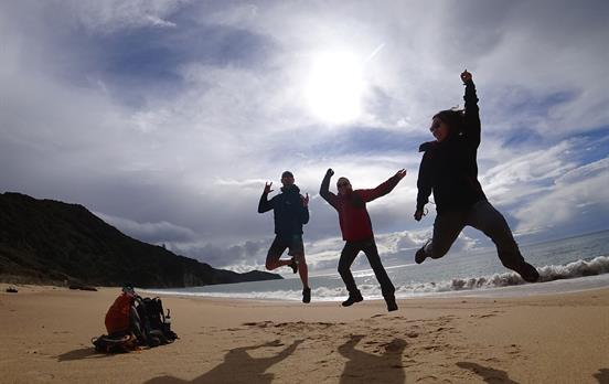 Jumping for joy whilst hiking on the track