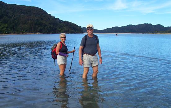 Wading across Awaroa Inlet