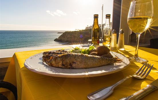 Get used to grilled seafood and a glass of vinho
