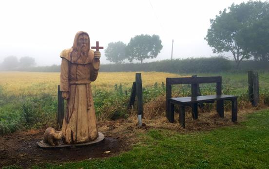 A carved wooden figure depicting St Cuthbert
