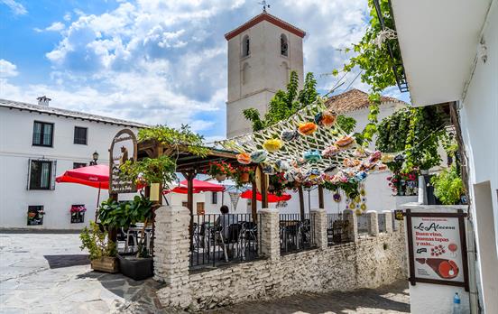 Have lunch in a vibrant village square