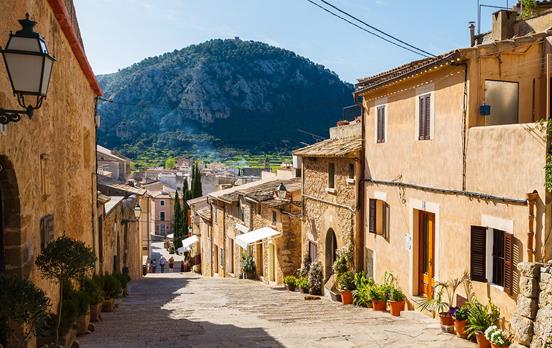 The honey-coloured houses in a street in Deia