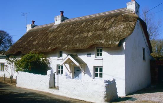 A traditional thatched cottage in Oxwich