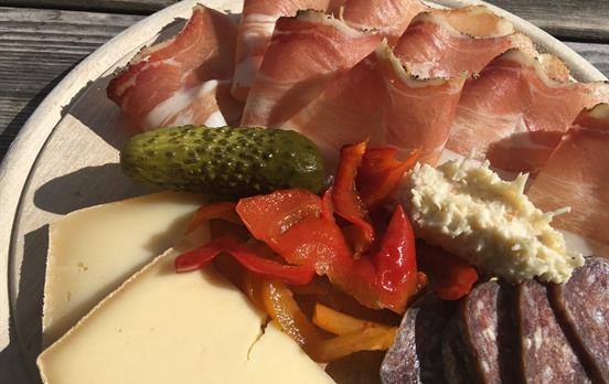 Sample some of the local meats and cheese