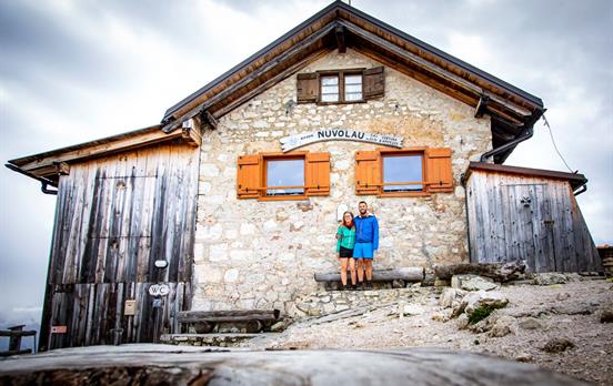 Hikers in front of mountain hut