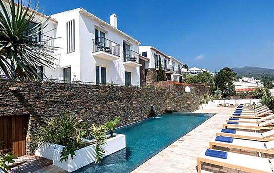 Relax by the pool at the Boutique Hotel Villa Gala