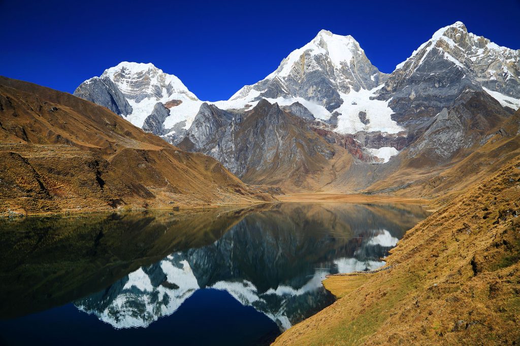 Mountains in Peru reflected in a lake