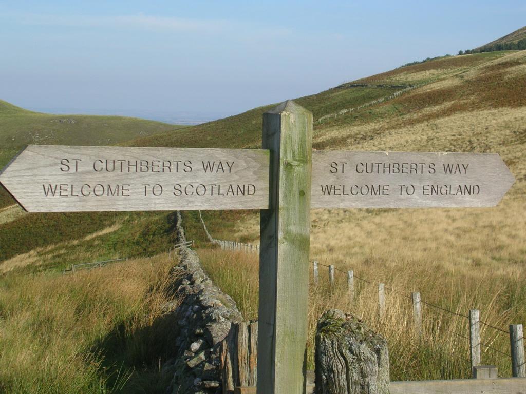 Signpost telling of the border crossing on the St Cuthbert's Way