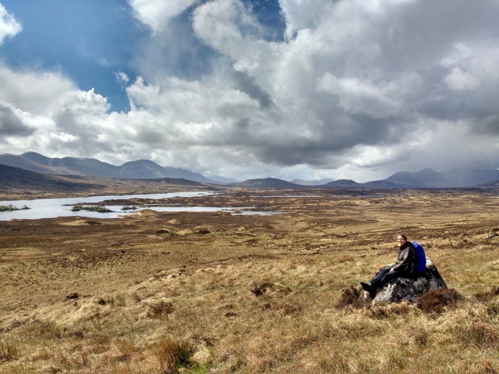 Hiker sits on the Rannoch Moor on the West Highland Way