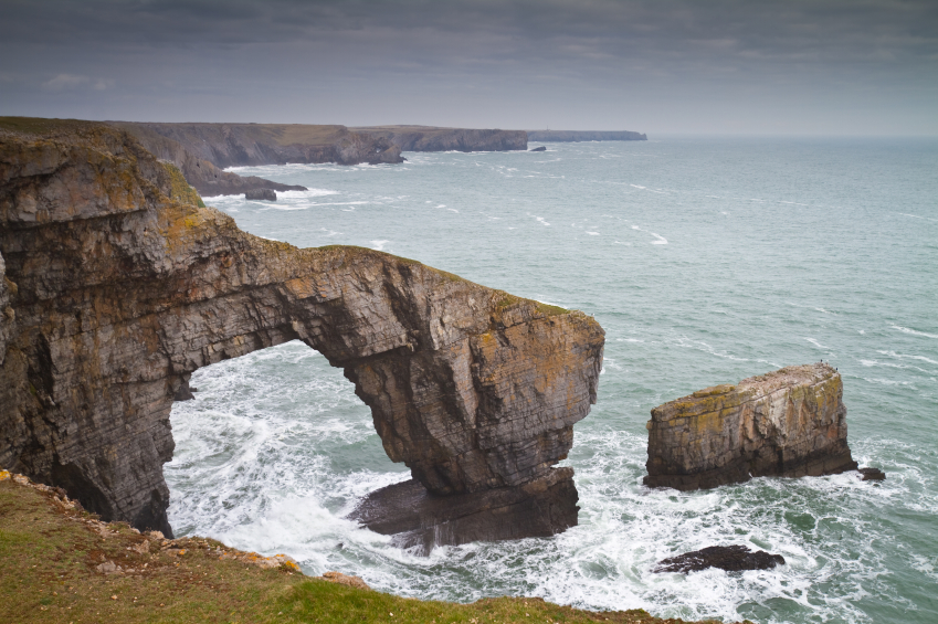 a coastal archway on the pembrokeshire coast path