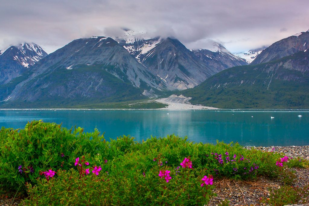 Snow capped Mountains, blue lake in Alaska